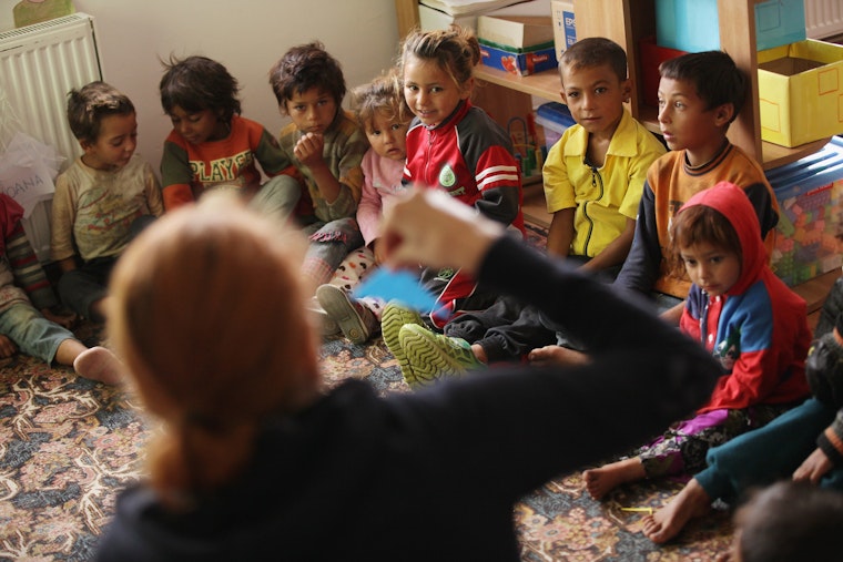 Preschool students study in a classroom together in the Roma settlement of Ponorata, Romania, in September 2013. Photo credit: © Sean Gallup/Getty Preschool children sitting in a circle