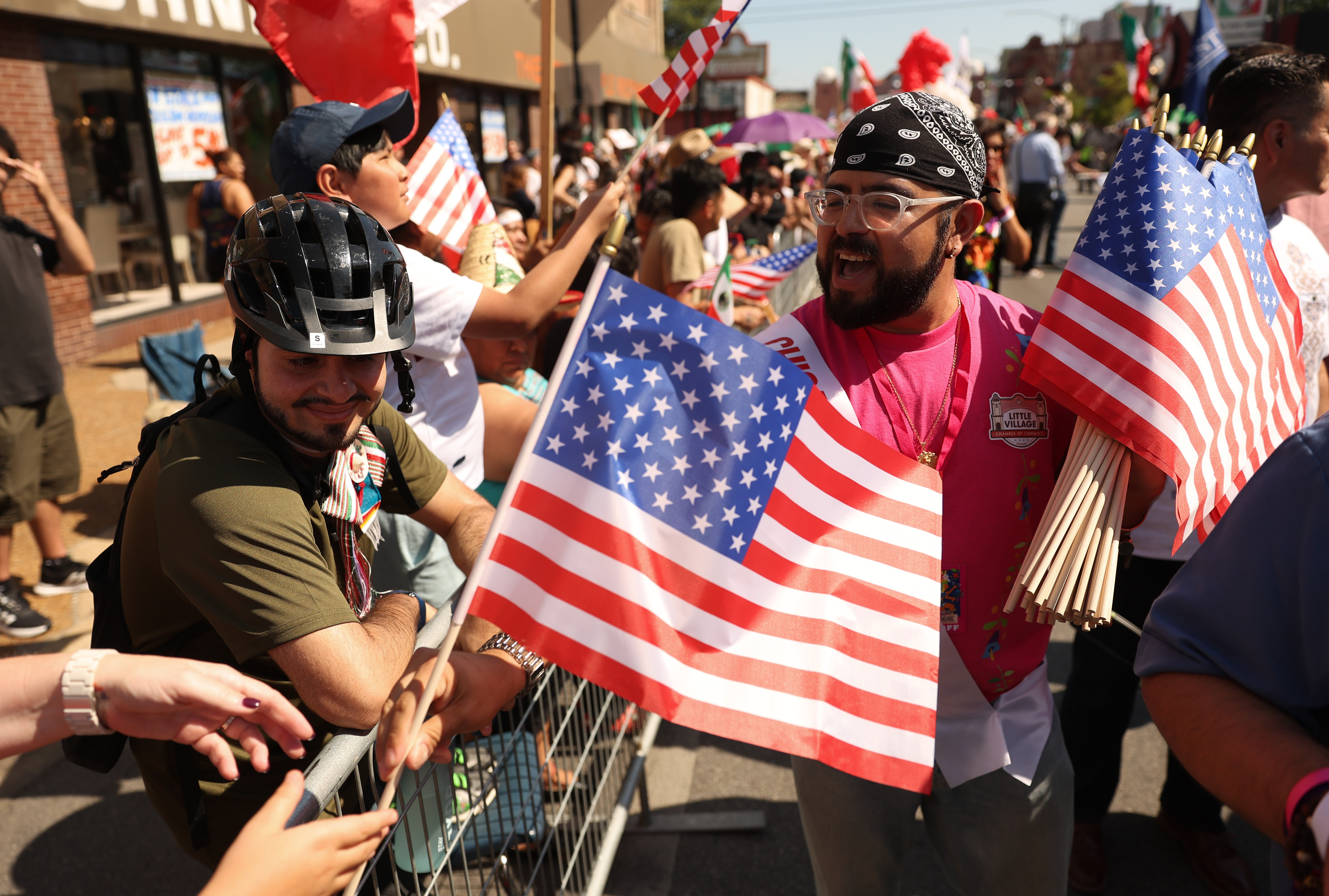 People at a parade with American flags