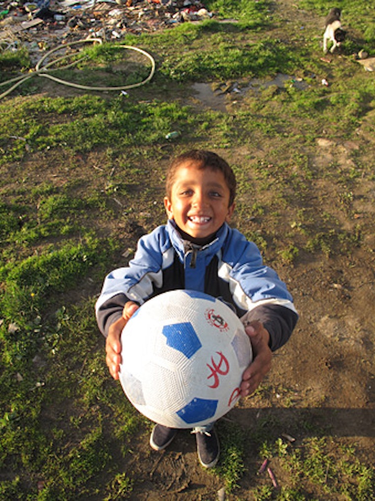 Mentor Malluta holding a soccer ball