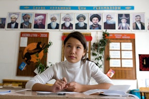 A girl sits in a classroom