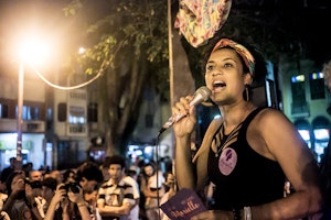 Marielle Franco with a microphone