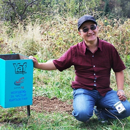 clean-kyrgyzstan-20101103 Adyljan Shamshiev poses next to trash receptacle at nature reserve