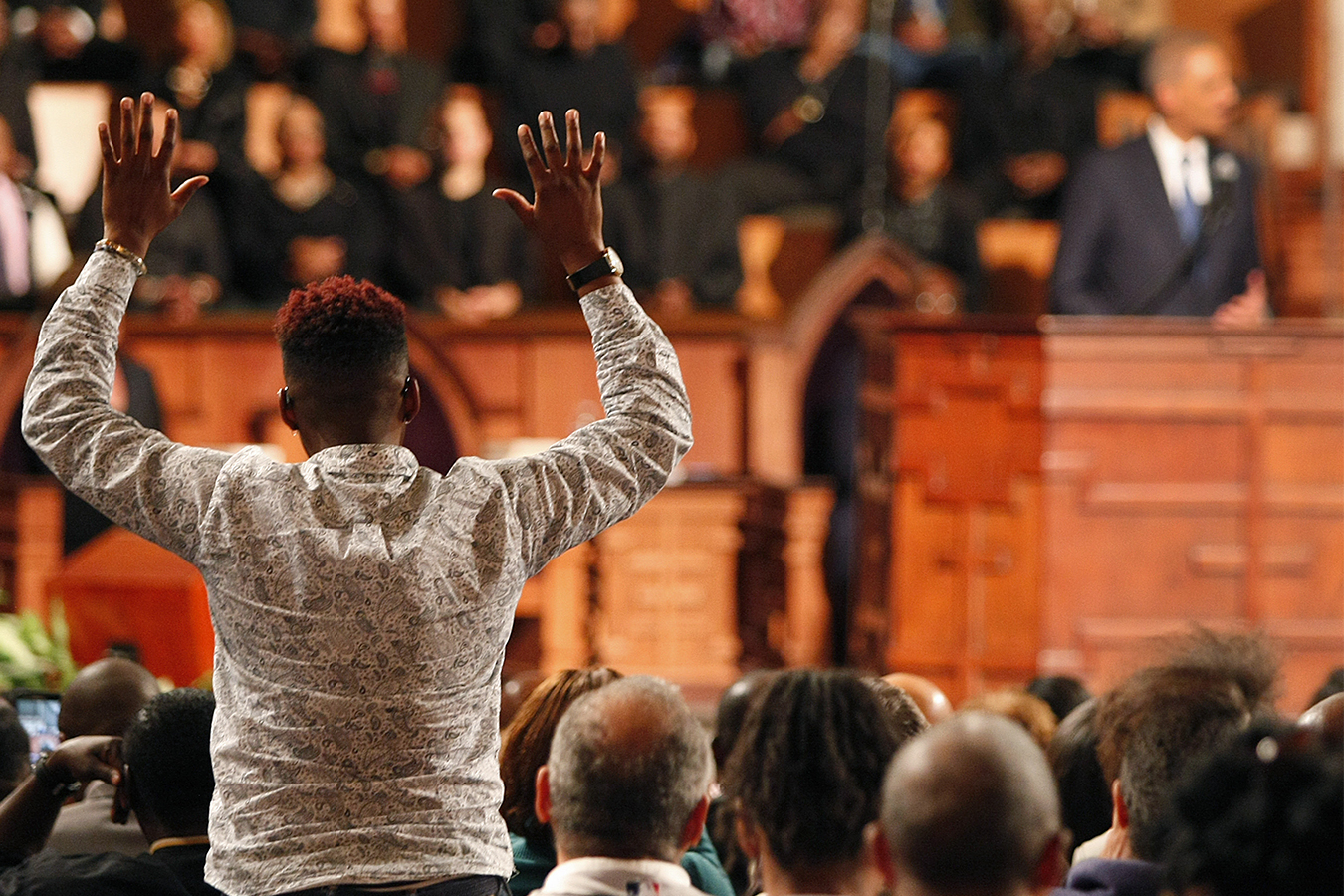 Woman holds her hand up