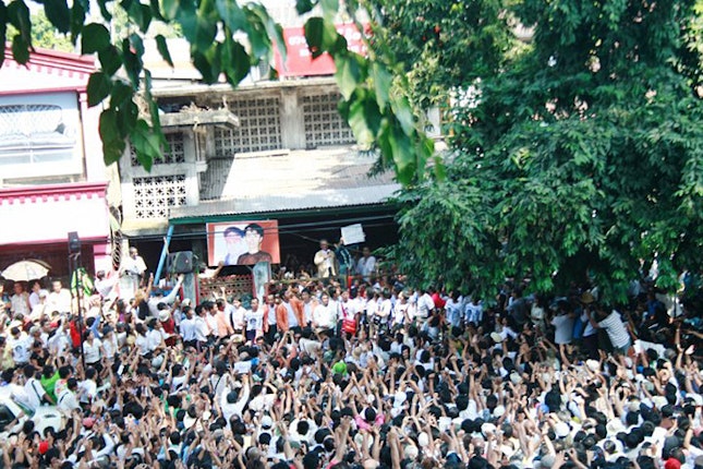 Large crowd cheering Daw Aung San Suu Kyi
