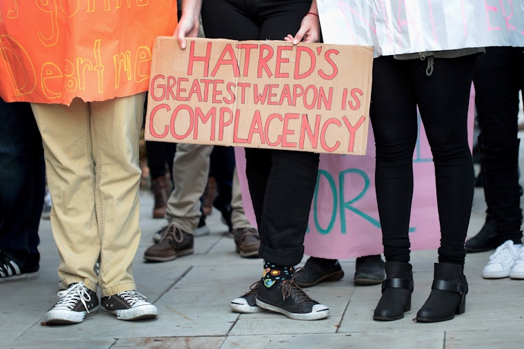 Students holding protest posters