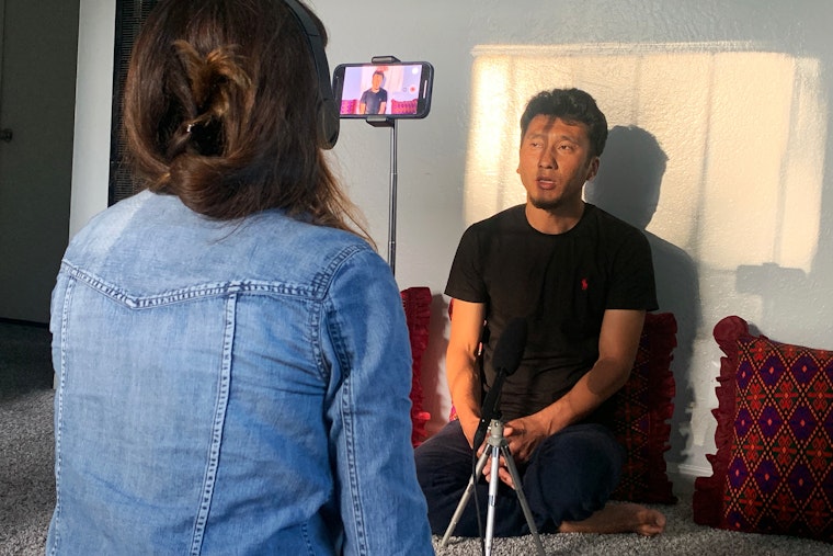 A participant being recorded for the project Afghan Voices: Voices of an Emerging Diaspora on May 12, 2022. Photo courtesy of Gaisu Yari An interviewer recording a participant