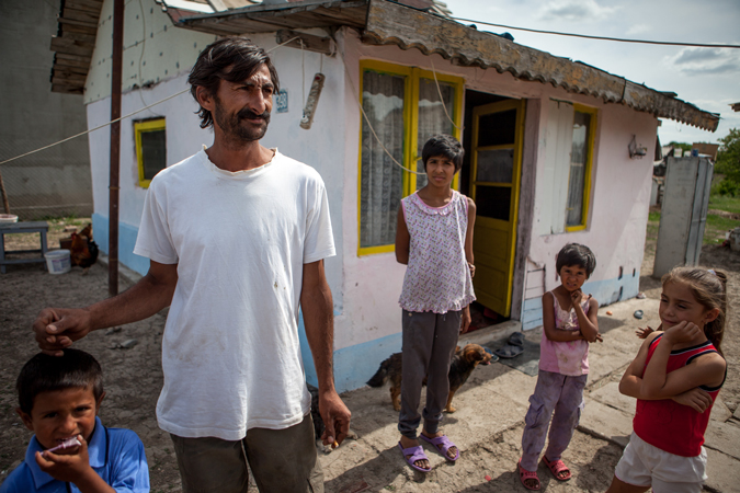 A man standing with children