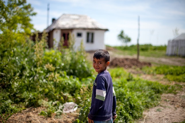 A young boy in the village of Frumuşani. From a total population of over 21 million people in Romania, the Roma population is young and approaching two million. Education offers a path for Roma to claim their own rights. Photo credit: © Bjorn Steinz/Panos for the Open Society Foundations A young boy