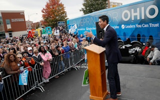 Aftab Pureval speaks at an event in Cincinnati, Ohio, on November 4, 2018. Photo credit: © John Minchillo/AP Aftab Pureval speaking at a podium