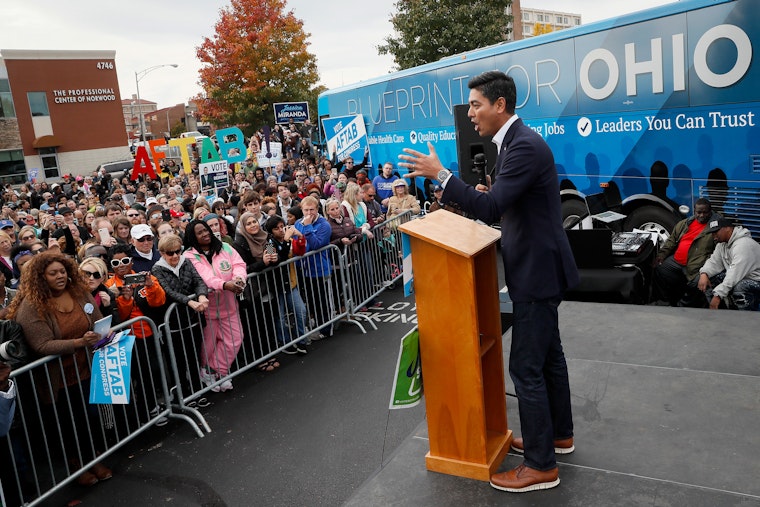 Aftab Pureval speaks at an event in Cincinnati, Ohio, on November 4, 2018. Photo credit: © John Minchillo/AP Aftab Pureval speaking at a podium