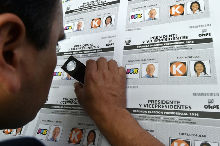 A technician inspects a final test printing of electoral ballots to be used in presidential elections in Lima, Peru, on May 12, 2016. Photo credit: © Cris Bouroncle/AFP/Getty Technician inspects electoral ballots