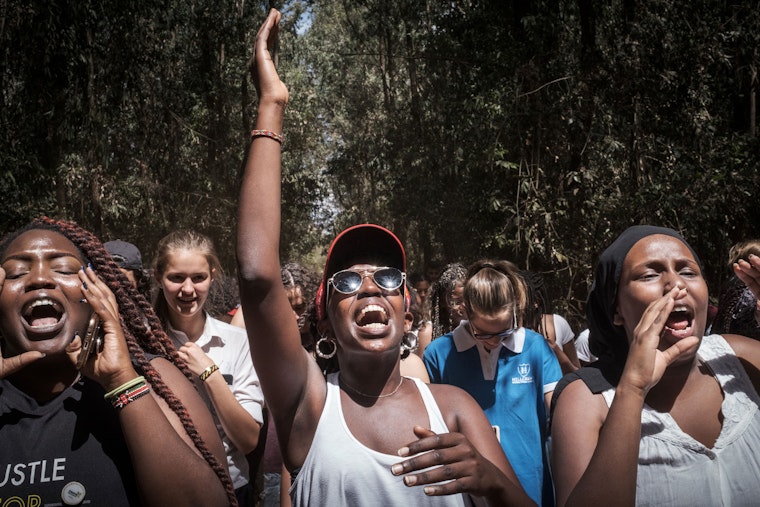 A group of women chanting.