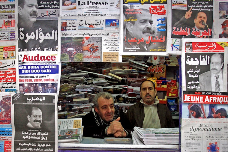 Two men in a newsstand