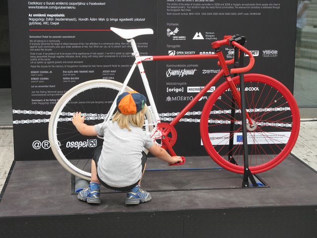 Boy playing with bike on display