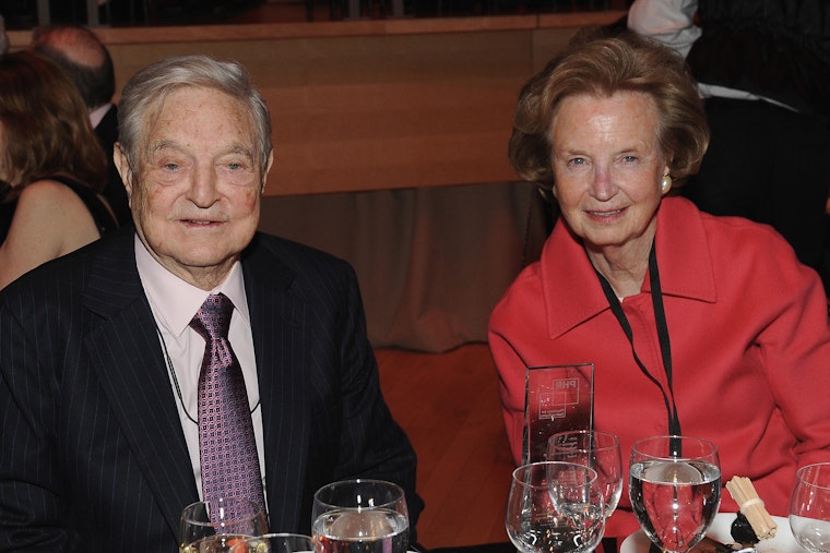 George Soros and Dr. Kathleen Foley attend the 2015 Physicians for Human Rights Gala in New York City on April 28, 2015. © D Dipasupil/Getty Images for Physicians for Human Rights An older man and an older woman sit together at a gala