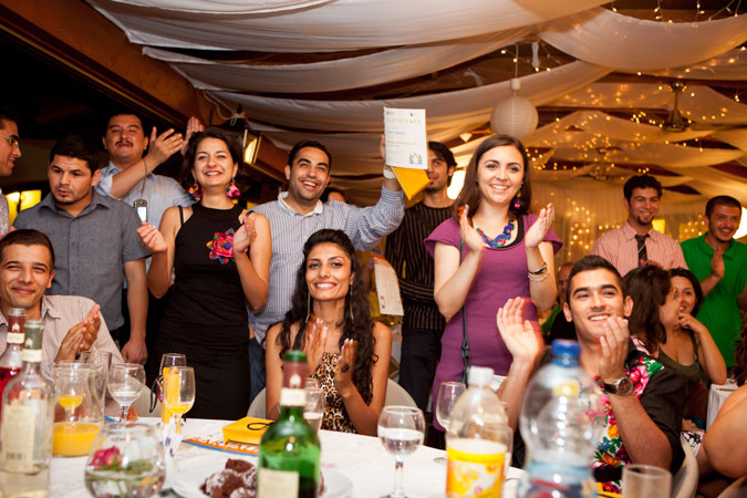 A group of people applauding.