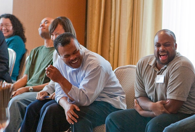 James Logan laughs with others at a Campaign for Black Male Achievement retreat