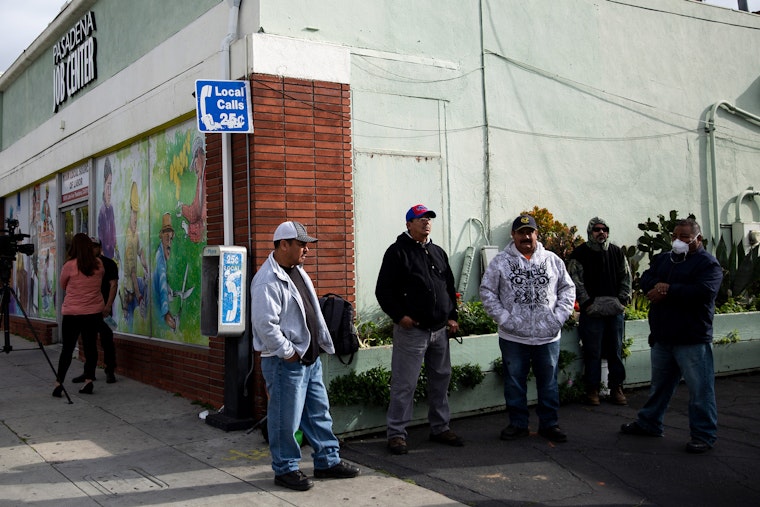 A group of people standing outside a building