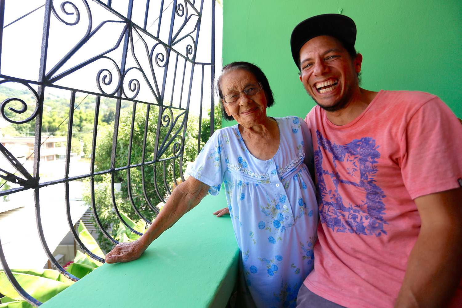 Two people smile and pose for a photo.
