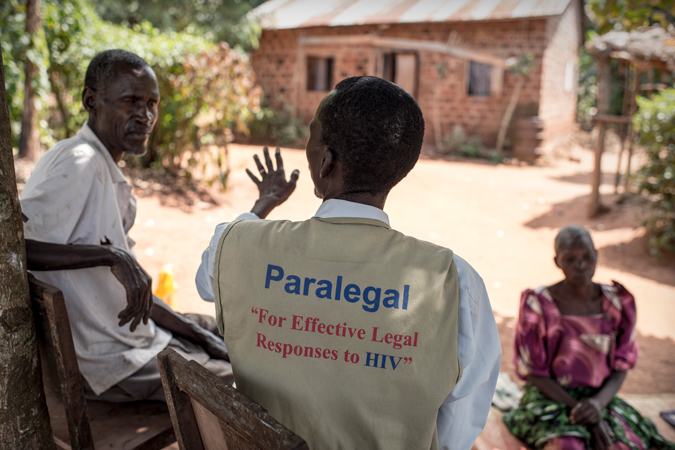 A man talking to two people