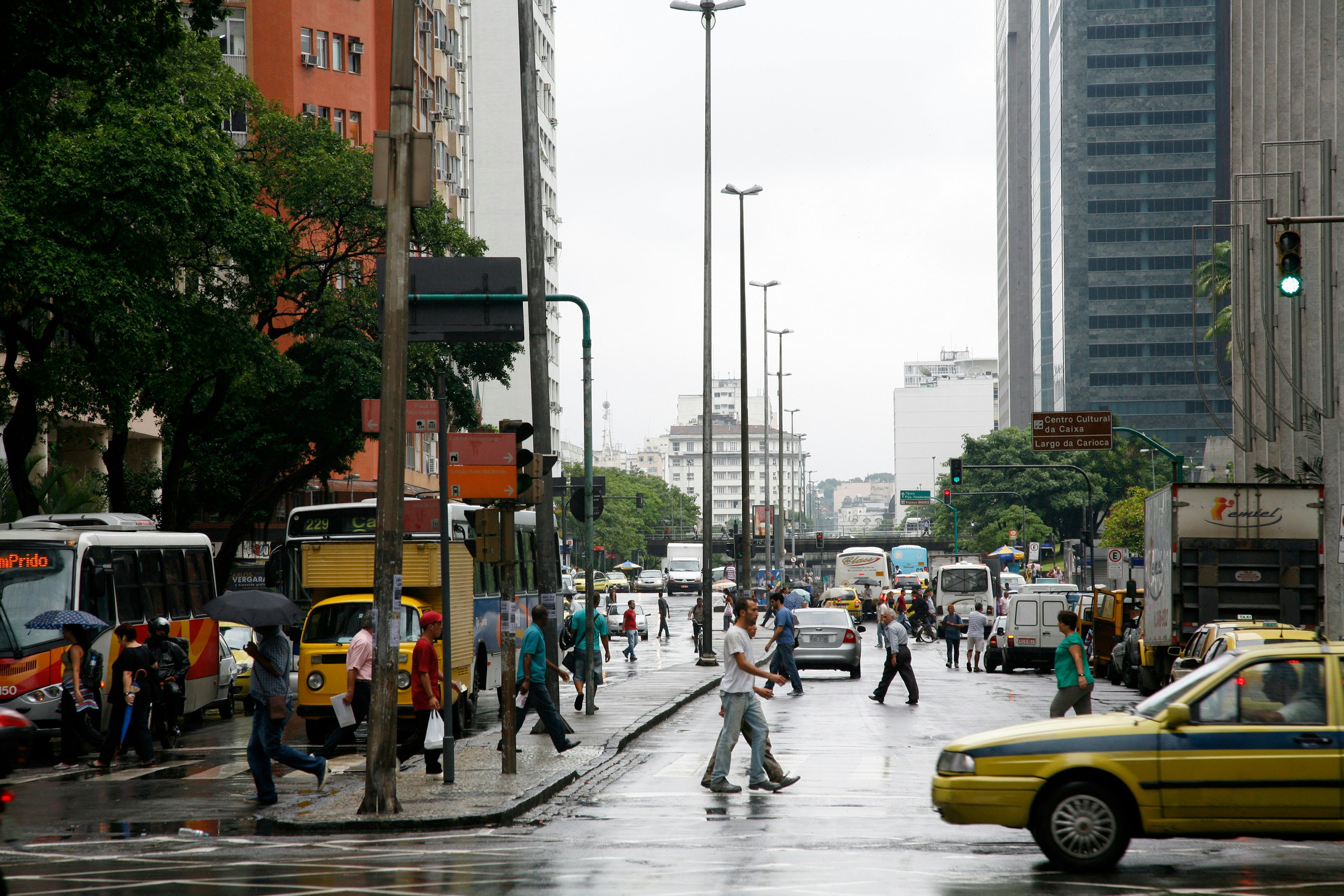Pedestrians cross an intersection in downtown Rio de Janeiro, Brazil.