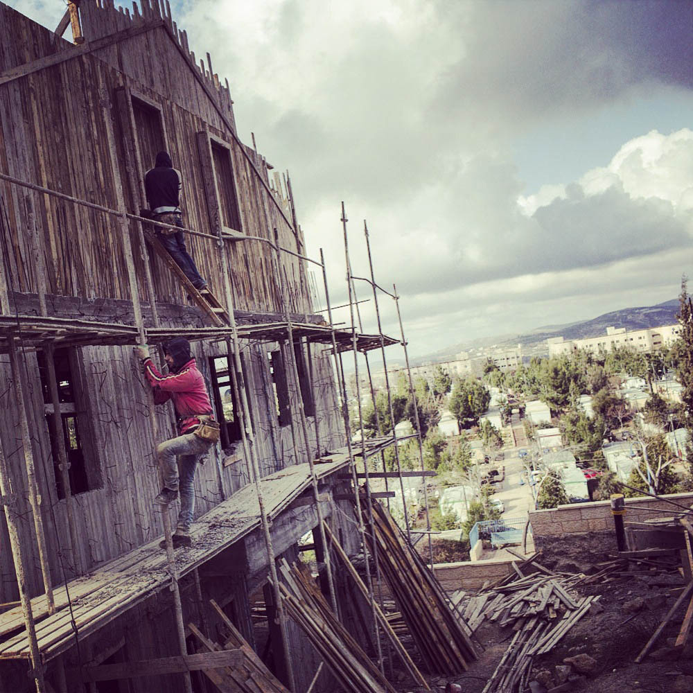 Men building a house