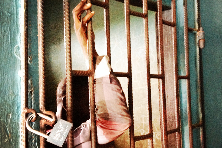 A suspect in a holding cell