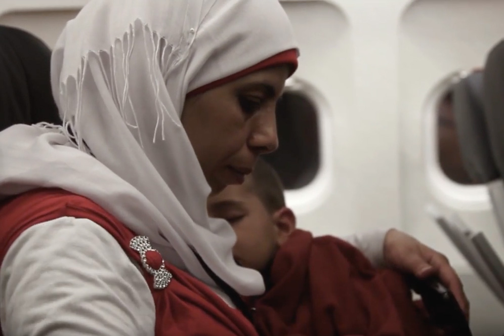 Woman and boy sitting on a plane