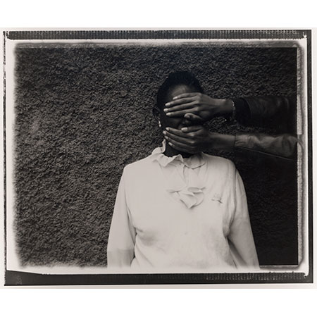 Girl with face covered