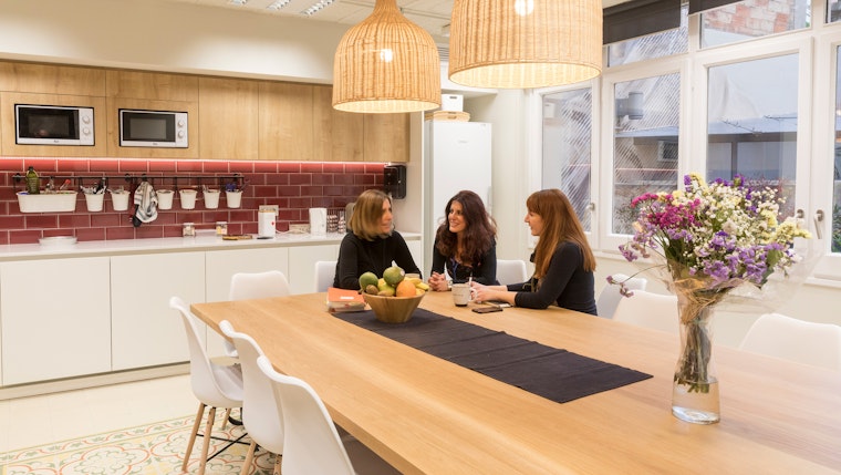 Open Society Barcelona office Three people in a kitchen