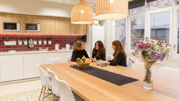 Three people in a kitchen