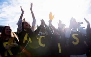 Activists cheer at a protest.