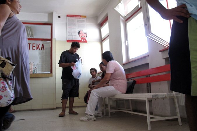 A woman sitting with a family