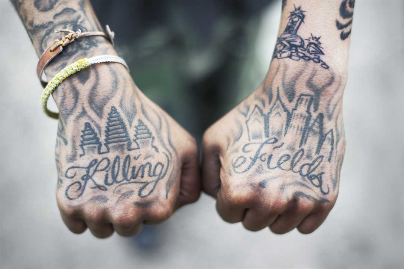 Man shows tattooed hands