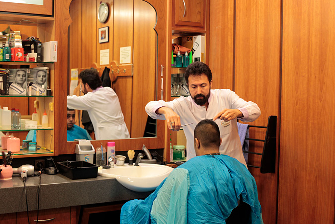 Barber giving a man a haircut