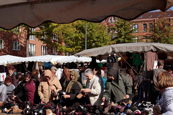 Shoppers at outdoor marketplace