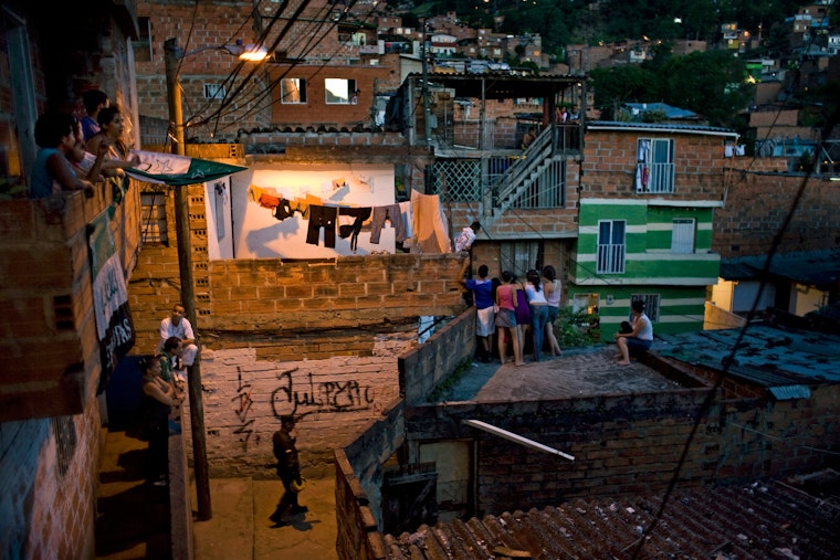 People look down at a murder scene in Medellin, Colombia, in September 2009. Photo credit: © Carlos Villalon/Redux People on balconies and rooftops