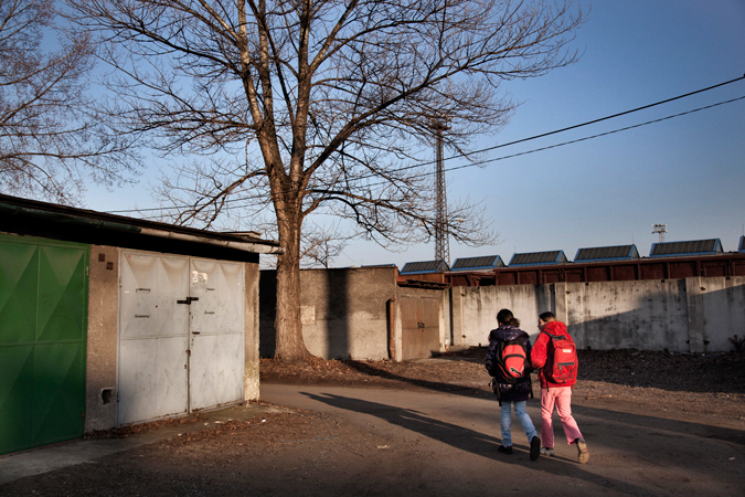 Two young children walking