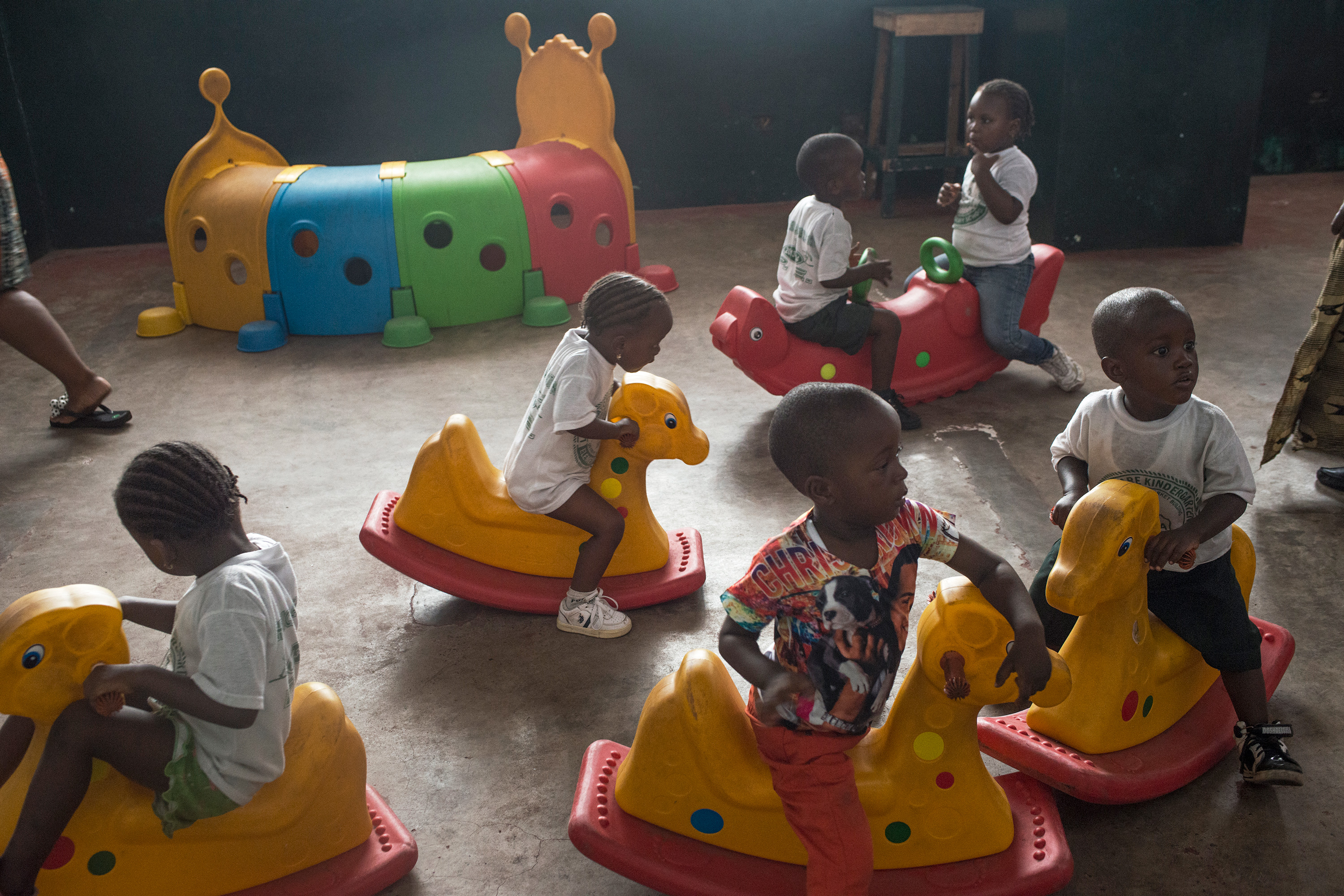 Young children on rocking horses